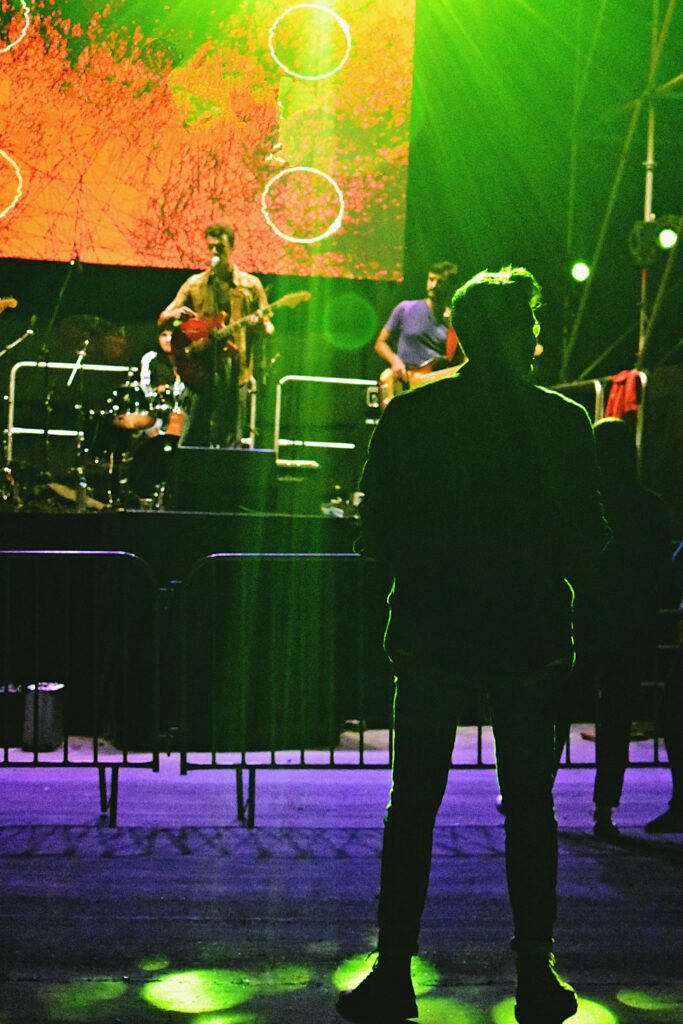 Exciting live concert with musicians performing on stage in Iași, Romania.